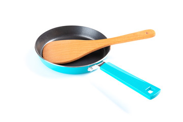 side view small metal pan and wooden spatula with clipping path