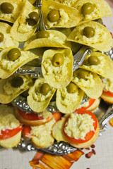 canapés with cheese and olives, sandwiches with cheese and tomatoes