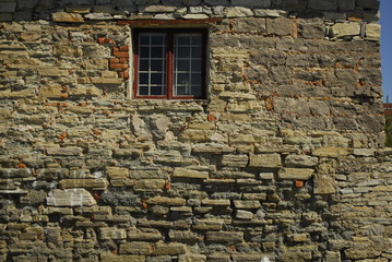 Fototapeta na wymiar old brick wall with window