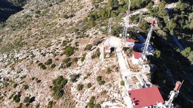 Aerial drone view of telecommunication antennas in Segaria mountain, in Marina Alta, Alicante, Spain