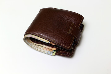 Brown leather wallet isolated on white background.