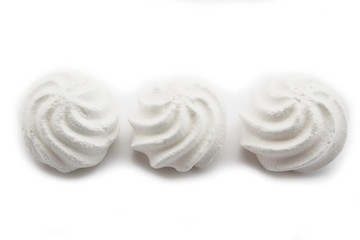 Small white meringues  isolated on white background