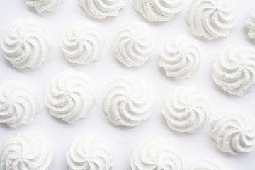 Small white meringues  isolated on white background