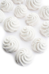 Small white meringues  isolated on white background