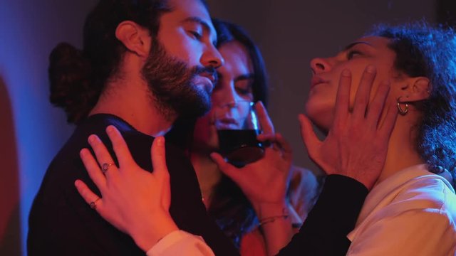 love triangle, love relationship with three.Three people flirting sensually 