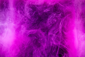 Ink in water isolated on white background. Rainbow of colors