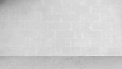 Cement wall with floor in the empty room and light for background.