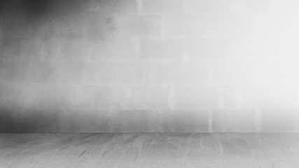 Cement wall with floor in the empty room and light for background.