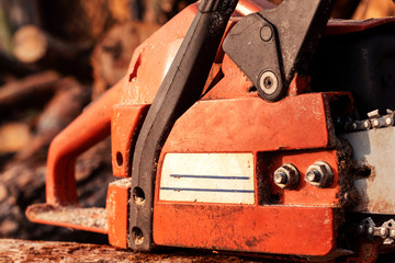 Professional chainsaw blade cutting log of wood. Heavy duty wood cutting equipment.