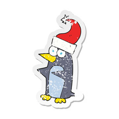 retro distressed sticker of a cartoon christmas penguin