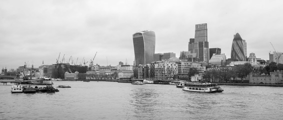 looking across the river thames at the financial district skyline