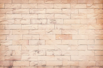 Outdoor old brown sandstone tones brick wall abstract seamless patterns for bright background or texture