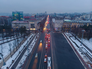 City center Chisinau at night with light and blue sky, government building and arch, Moldova. Aerial drone view