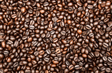 Close up photo of roasted coffee beans. Roasted coffee beans texture,  background and wallpaper.