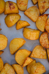 Close up of baking tray with Patatas Bravas, a traditional Spanish tapas dish, potato cubes or wedges roasted, baked or deep fried until tender and cripsy on the outside