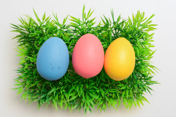 Easter eggs on white background with copy space