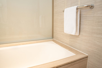 a modern bathroom with a towel hanging on a towel rack