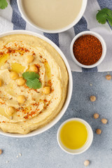 Traditional hummus and ingredients for cooking. Top view.