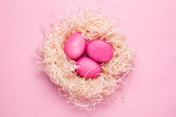 Easter pink eggs on a pink background