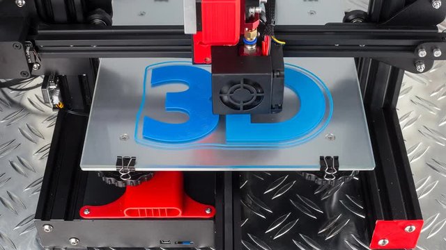 Red black 3D printer printing blue logo symbol on metal diamond plate future technology modern concept