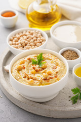 Homemade hummus dip with chickpeas, olive oil and paprika.