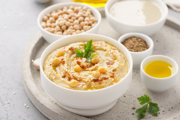 Homemade hummus dip with chickpeas, olive oil and paprika. - obrazy, fototapety, plakaty