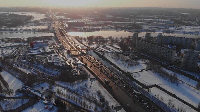 Flying over the motorway. The road in the winter in Moscow. Road bridge in the afternoon in winter.