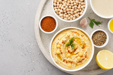 Hummus bowl and raw ingredients for cooking.