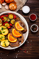 Fototapeta na wymiar Grilled steak, boiled potatoes and vegetables