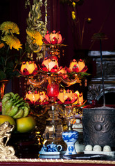 Fototapeta na wymiar Gild lamp in a buddhist Temple, Vietnam