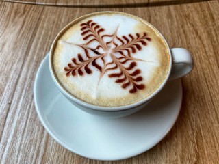 Topping latte coffee