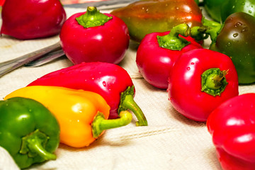 Bell peppers on a white towel in the kitchen