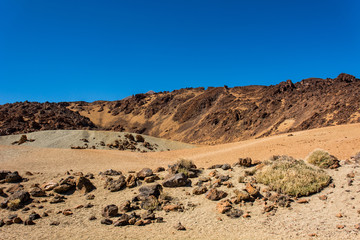 Spectacular volcanic landscape in desert environment with wicked lava shapes.