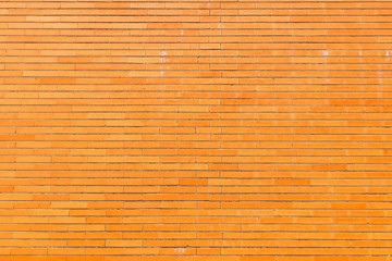 Orange brick wall texture. Architectural detail, closeup. Material background.