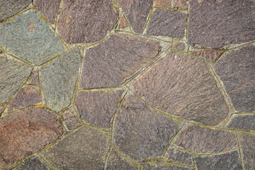 Porphyry floor texture. Architectural detail, closeup. Material background. Porous, rough and very resistant magmatic rock.