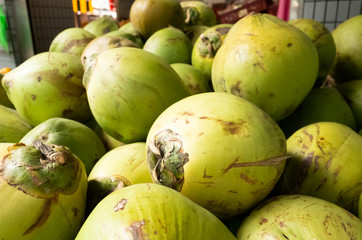 coconut fruit stacked on the marketplace