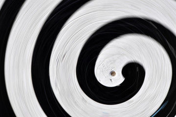 A spinning disk with a black line.