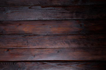 Dark wooden background. Abstract texture. Top view of the wooden boards