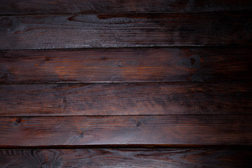 Fototapeta premium Dark wooden background. Abstract texture. Top view of the wooden boards