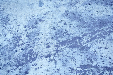 Abstract blue dark spotted wall background.
