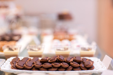 Table with delicious candy, cupcakes, cakepops, macaroons and other sweets