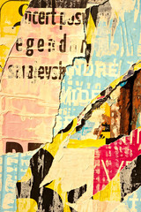 Fototapeta premium Old grunge ripped torn vintage collage colorful street posters creased crumpled paper surface placard texture background backdrop