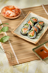 Korean roll Gimbap(kimbob) made from steamed white rice (bap) and various other ingredients