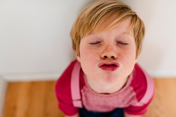 Portrait of a young boy wearing pink © Elizabeth