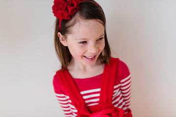 Portrait of young girl wearing red