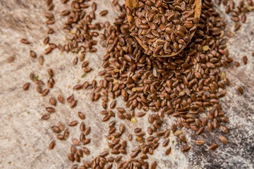 Flax seeds wooden spoon scattered carelessly menu ingredient