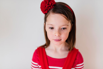 Portrait of young girl wearing red