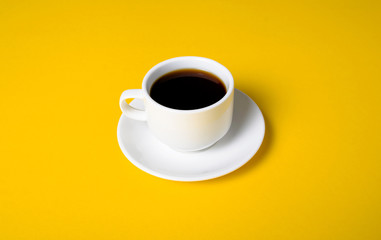 Cup of coffee drink on yellow background
