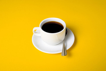 Cup of coffee drink on yellow background