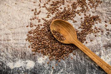 Flax seeds wooden spoon scattered carelessly menu ingredient